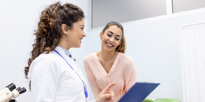 Female doctor consulting with female patient