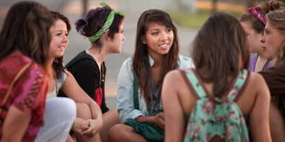 adolescents discussing their health needs in a group