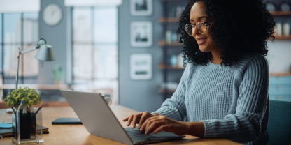 Woman typing on a computer