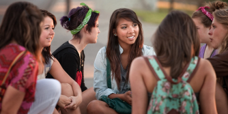 adolescents discussing their health needs in a group