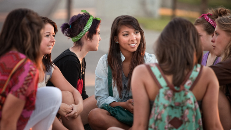 adolescents discussing their health needs in a group