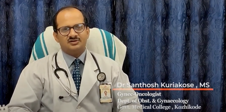 Image of Dr Santosh Kuriakose sitting down, wearing a white coat.